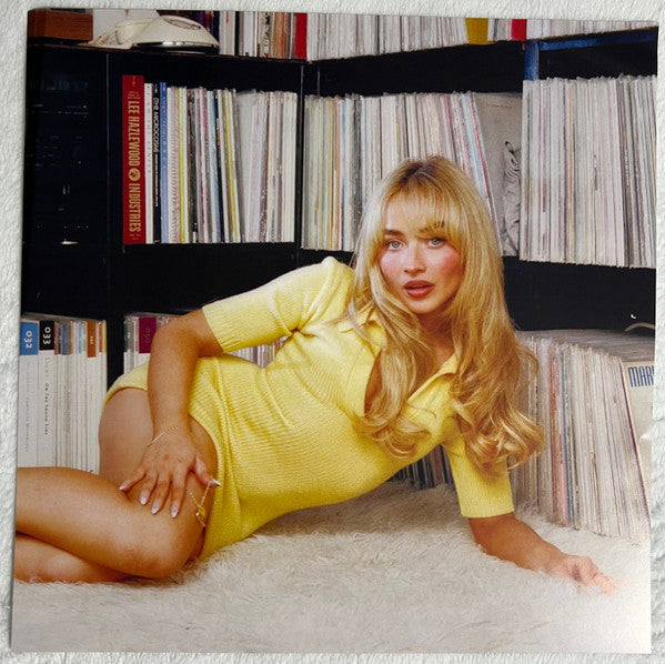 Sabrina Carpenter Short N' Sweet vinyl LP photo insert, Sabrina in front of record shelves