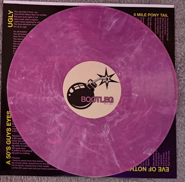 The Garden Bootleg limited edition frosted pink vinyl record and bomb label